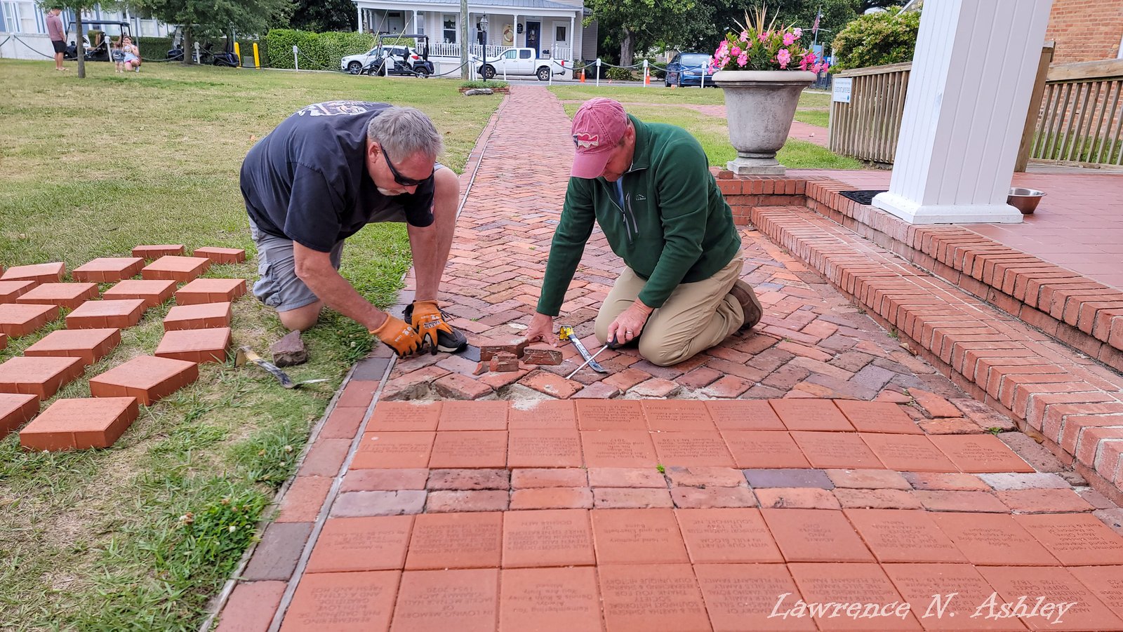Volunteers laying the commemorative brick walkway
