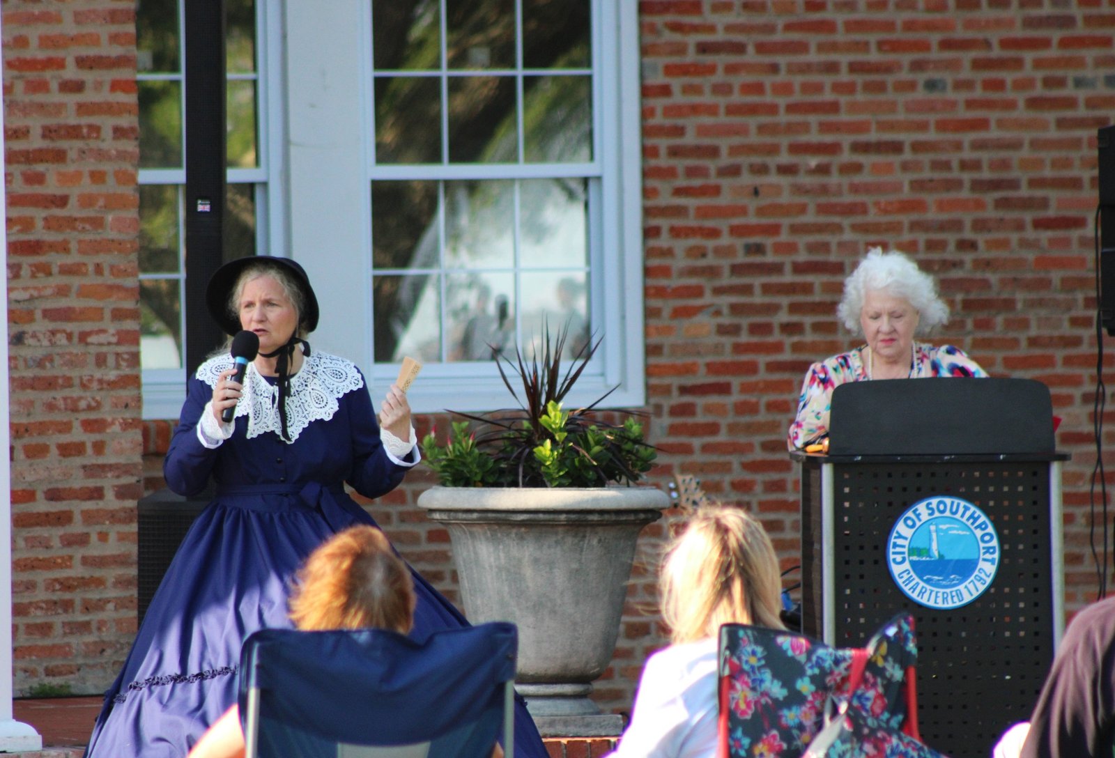 Costumed interpreter addressing an outdoor audience