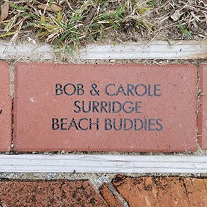 Engraved brick: Bob and Carole Surridge, Beach Buddies